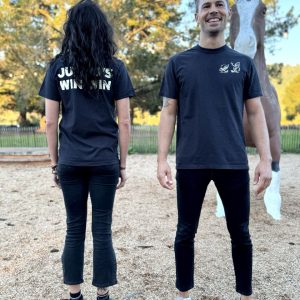 A man and a woman wearing black Jumbo's T-shirts